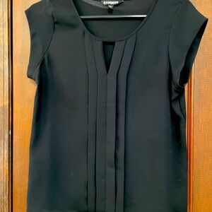 Black cap sleeve blouse, small V in neck, 4 pleats down the front